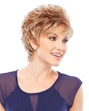 Load image into Gallery viewer, Woman with styled short hair wearing a blue top on a white background
